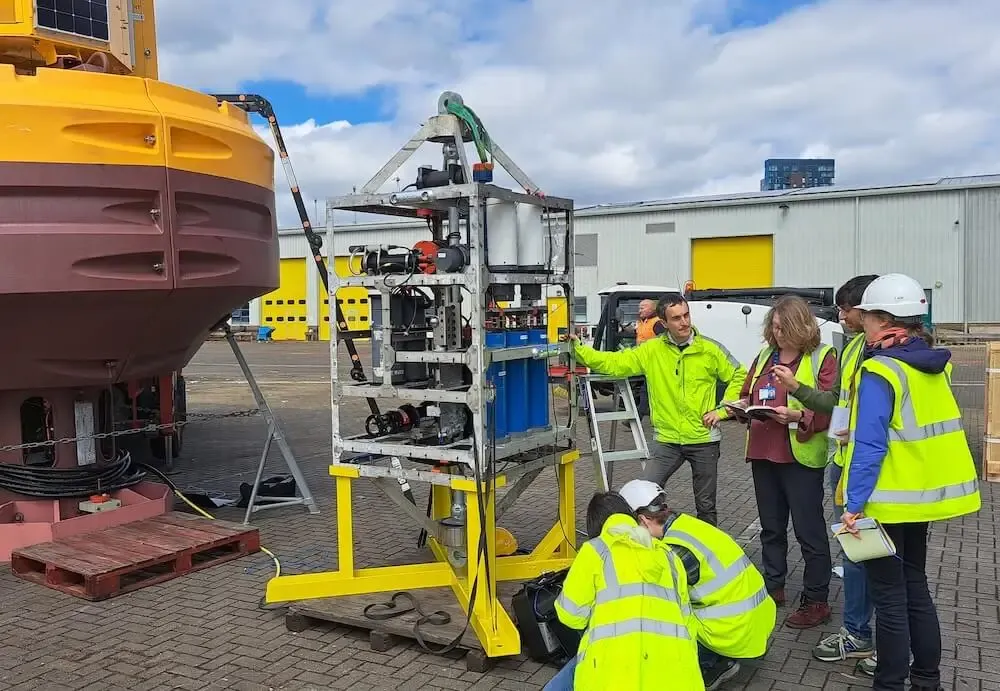 Working on the PAP Met Office buoy and sensor frame on the quay at NOC.